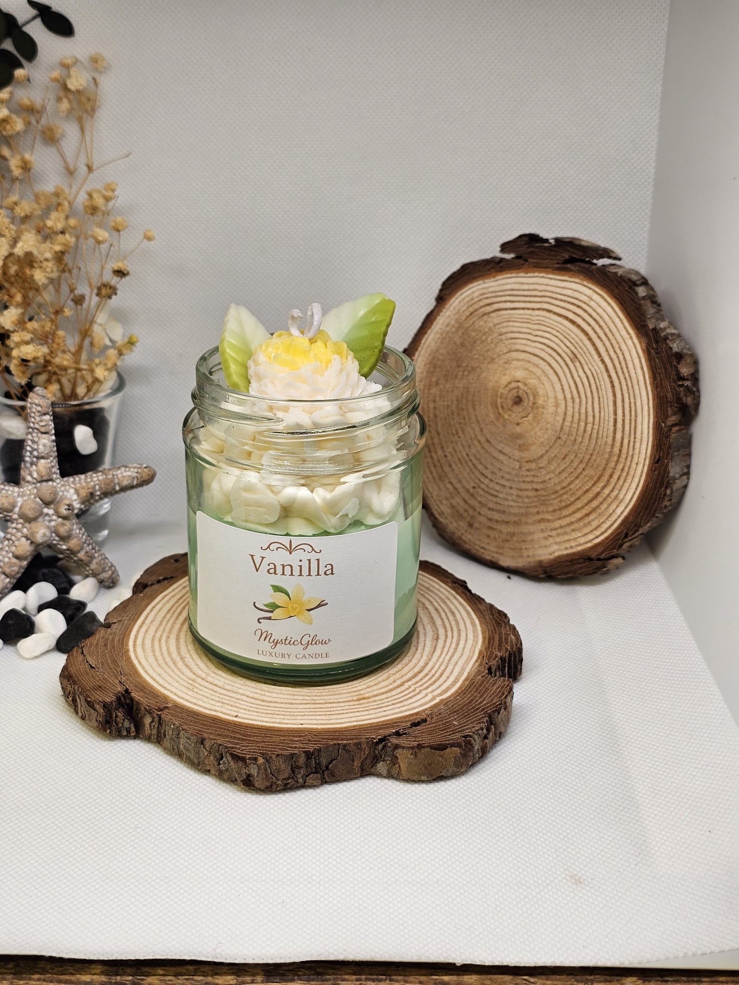 Hand-poured vanilla candle with realistic wax petals and gentle aroma