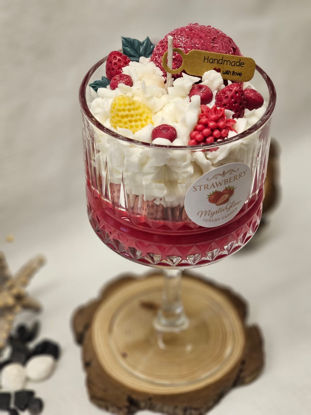 Luxury strawberry-scented candle in dessert glass by MysticGlow
