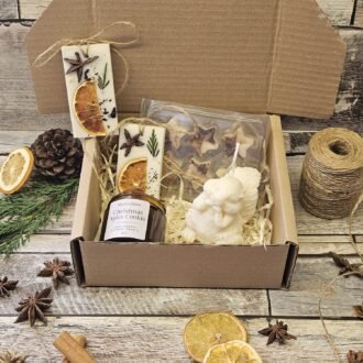 MysticGlow Christmas candle gift box with soy candle, wax tablets, wax melts and angel candle displayed in kraft box