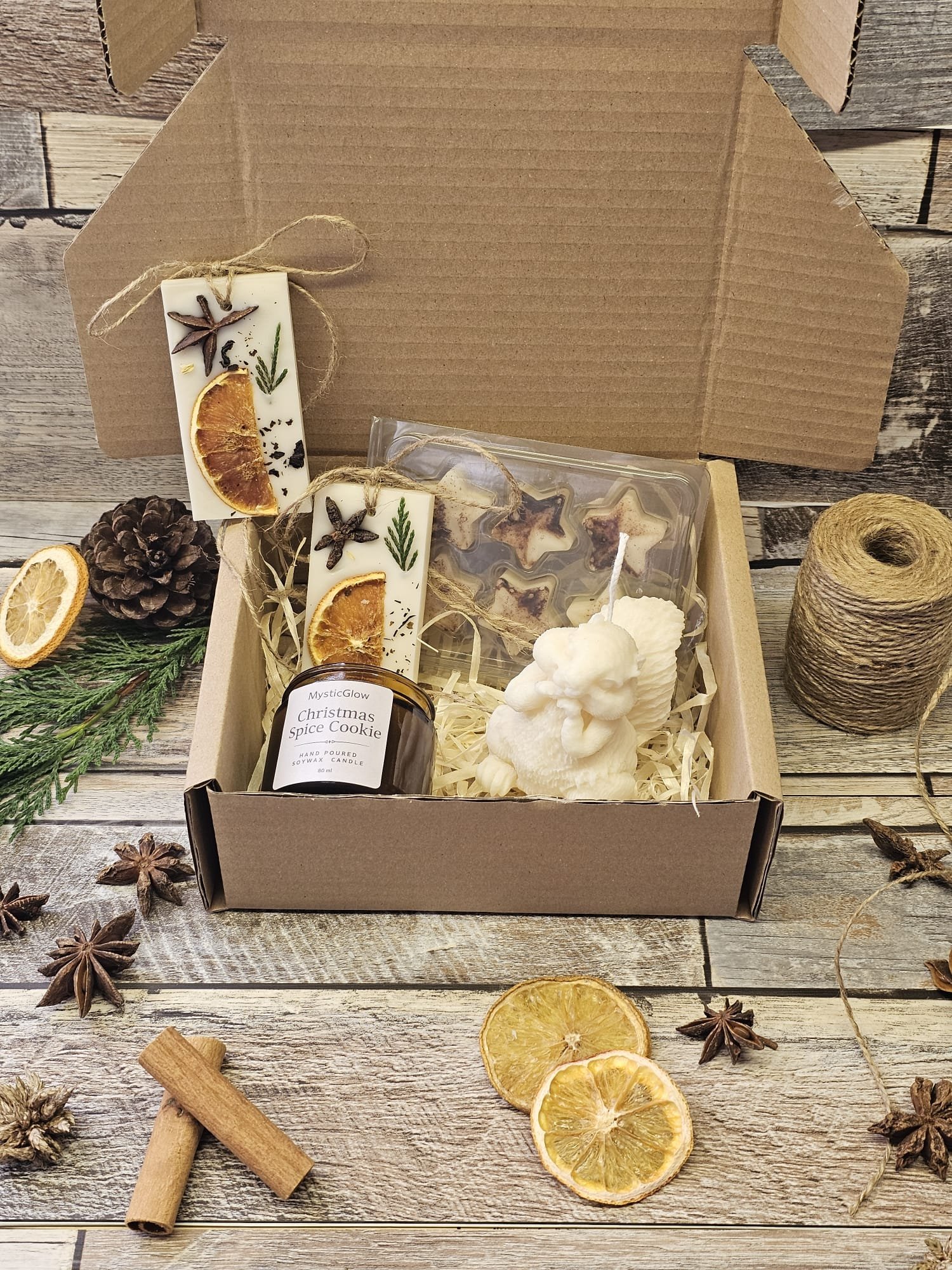 MysticGlow Christmas candle gift box with soy candle, wax tablets, wax melts and angel candle displayed in kraft box