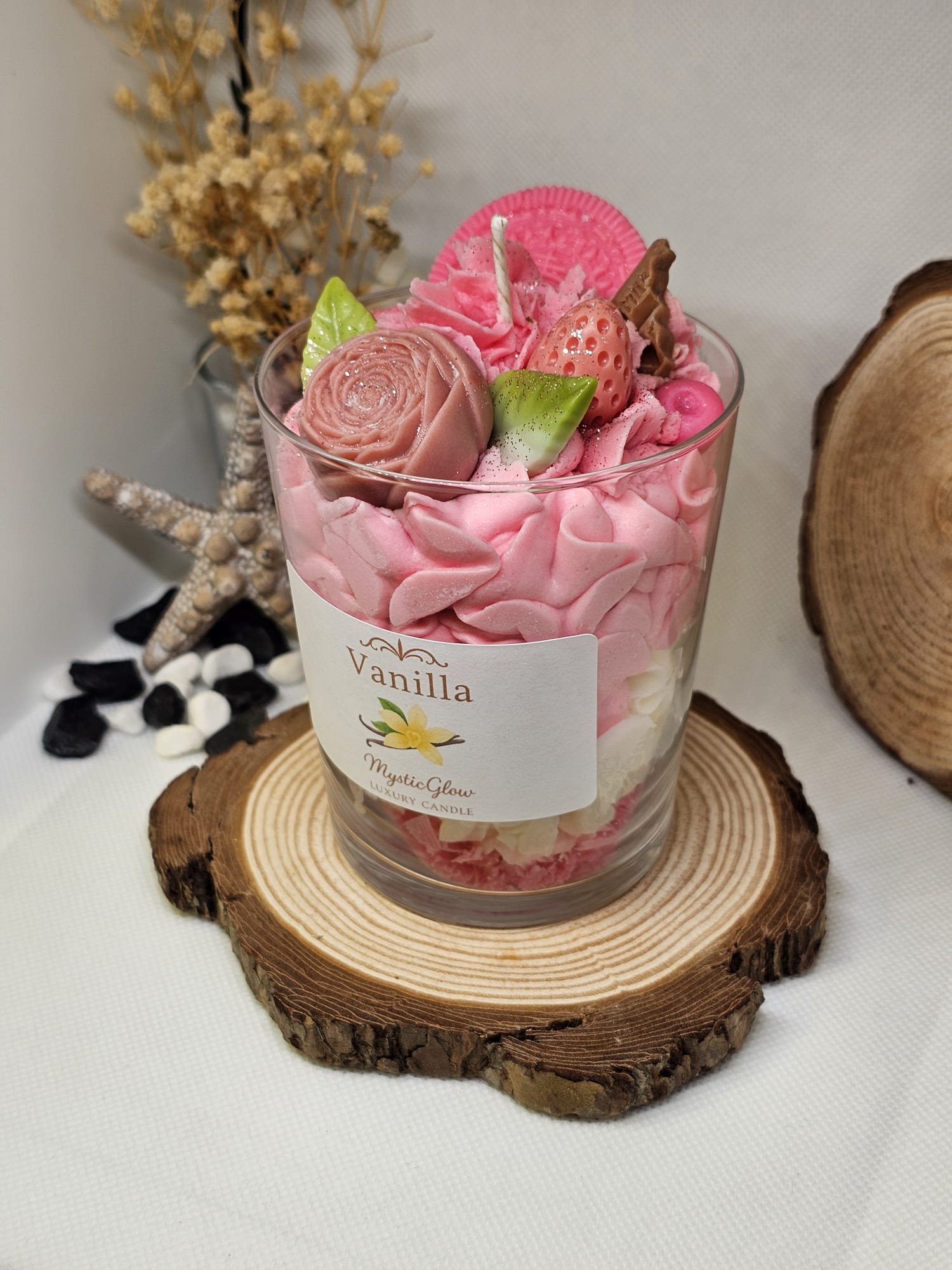 Luxury pink and white vanilla candle on wooden display – MysticGlow