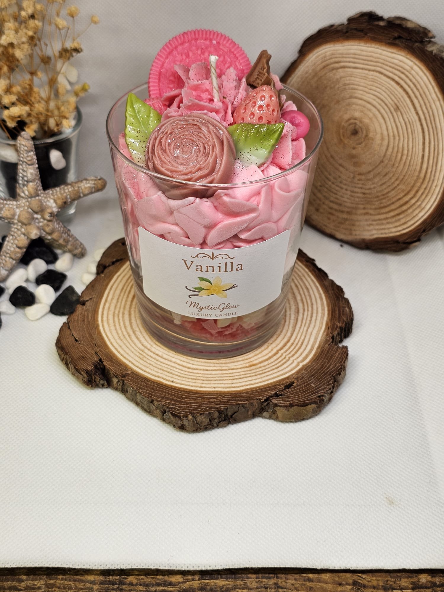 Handcrafted soy candle with dessert-style decorations by MysticGlow