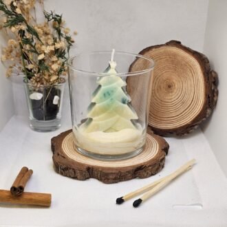 Hand-poured soy wax Christmas candle in glass jar with rustic home decor background