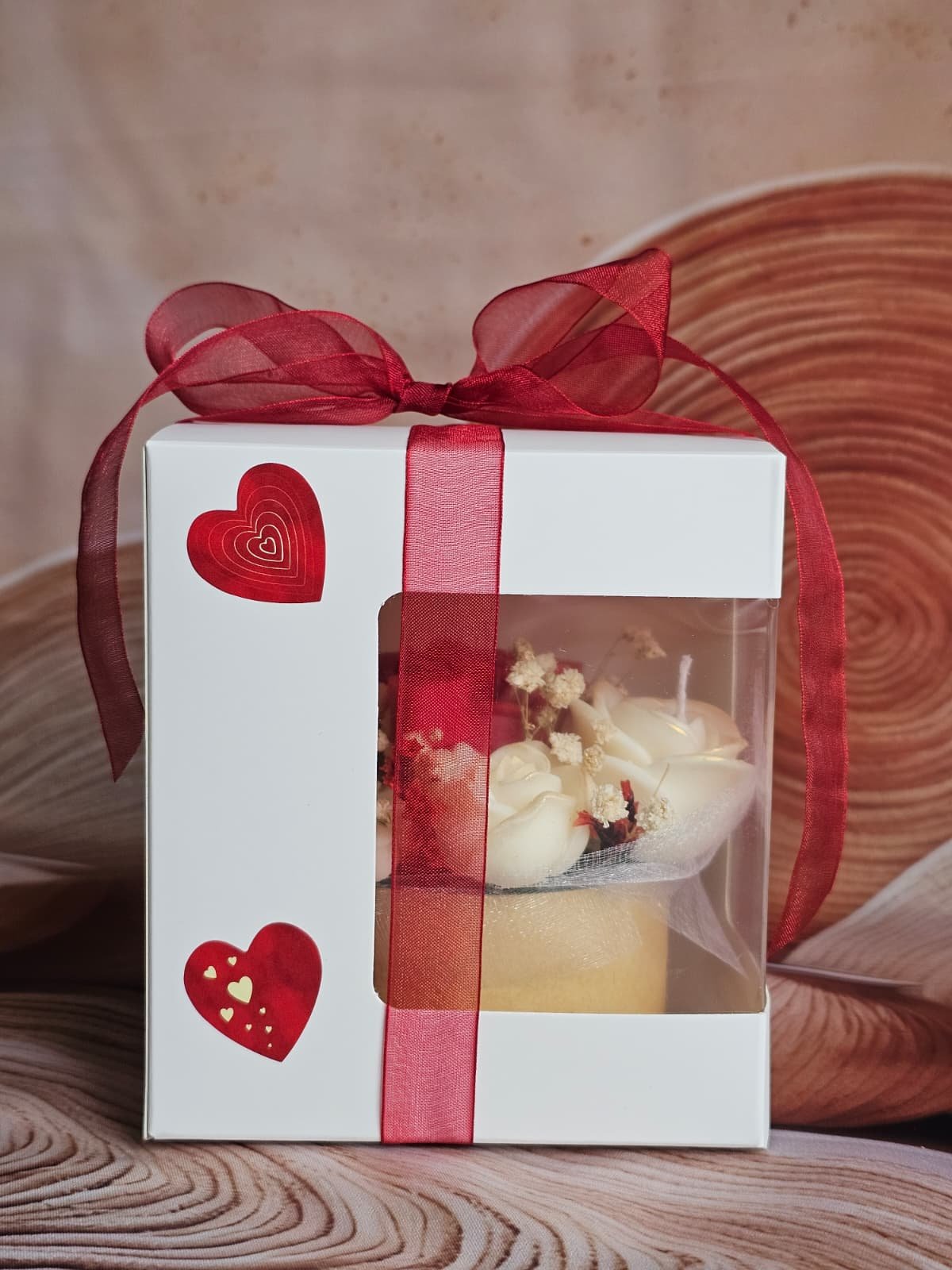 Front view of red and ivory rose candle arrangement on wooden base – MysticGlow