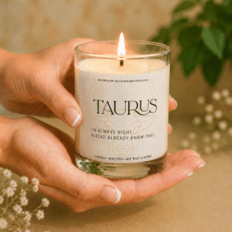 Handmade Taurus zodiac soy candle held in hands