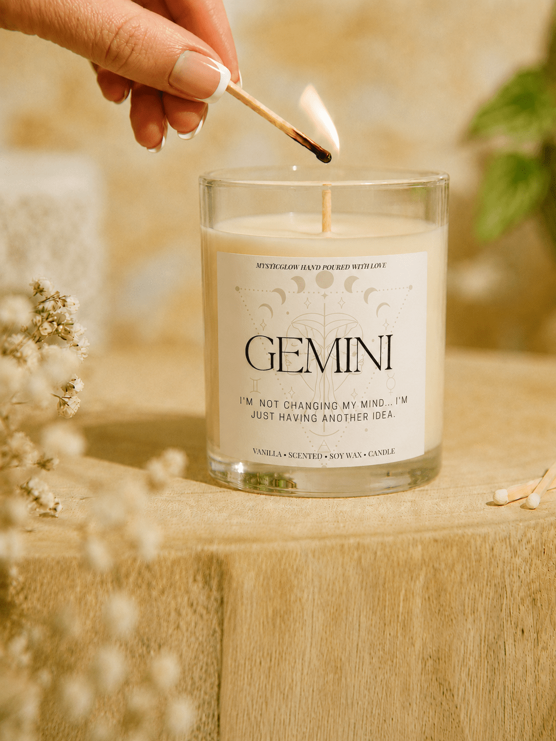 Gemini zodiac candle being lit by hand by MysticGlow
