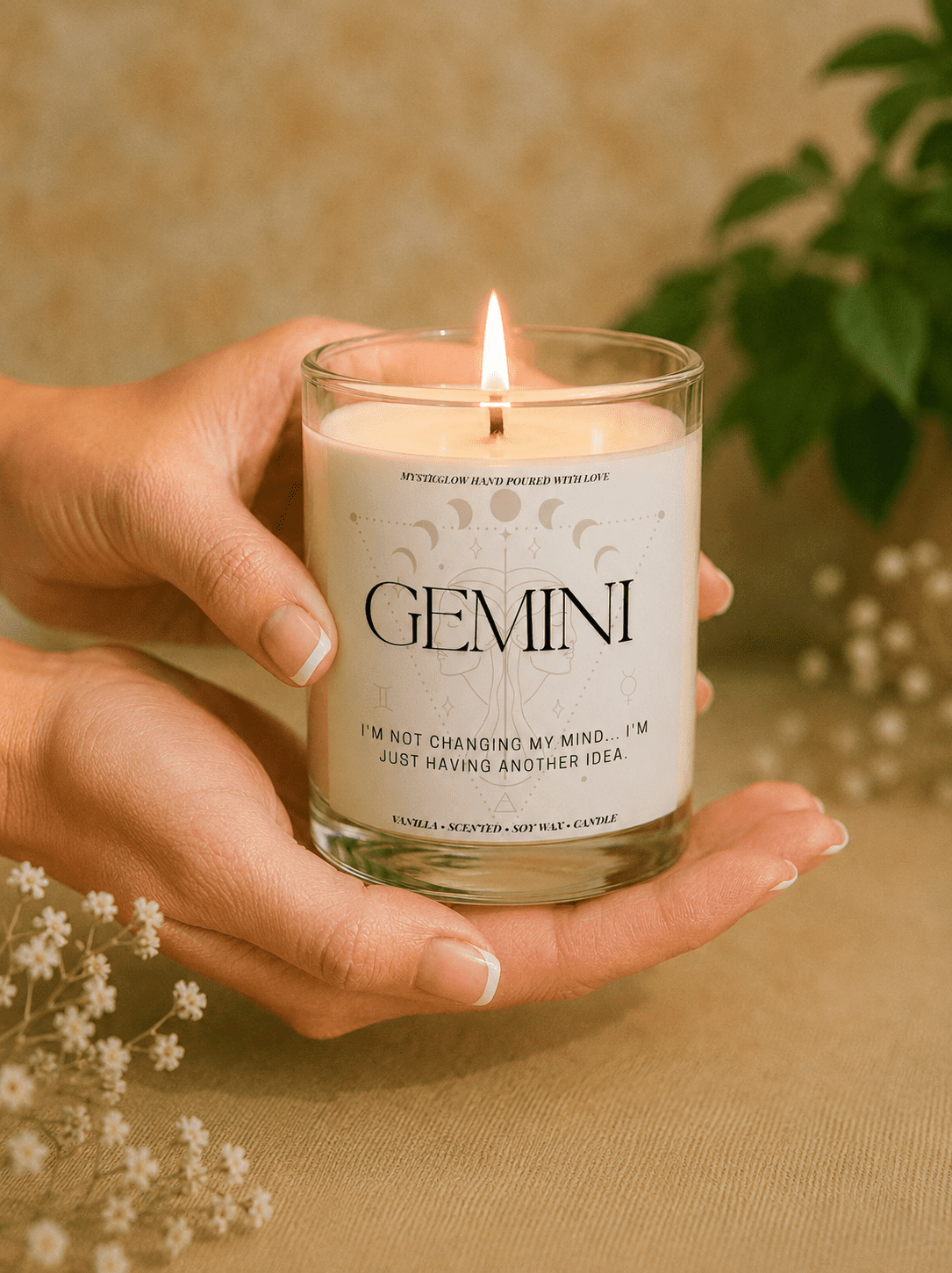 Handmade Gemini zodiac soy candle held in hands