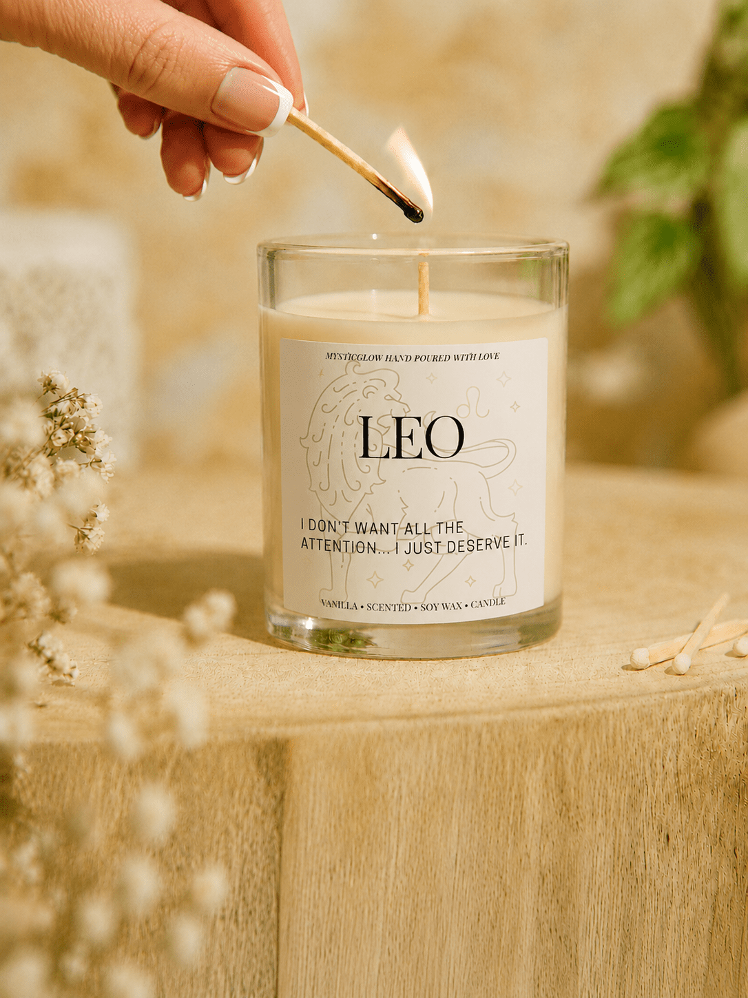 Leo zodiac candle being lit by hand by MysticGlow