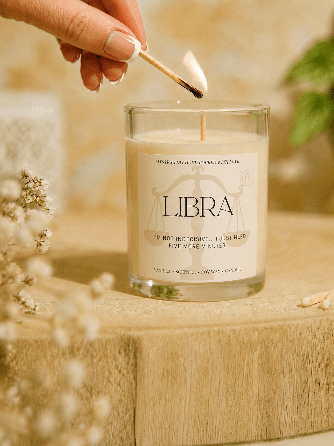 Libra zodiac candle being lit by hand by MysticGlow