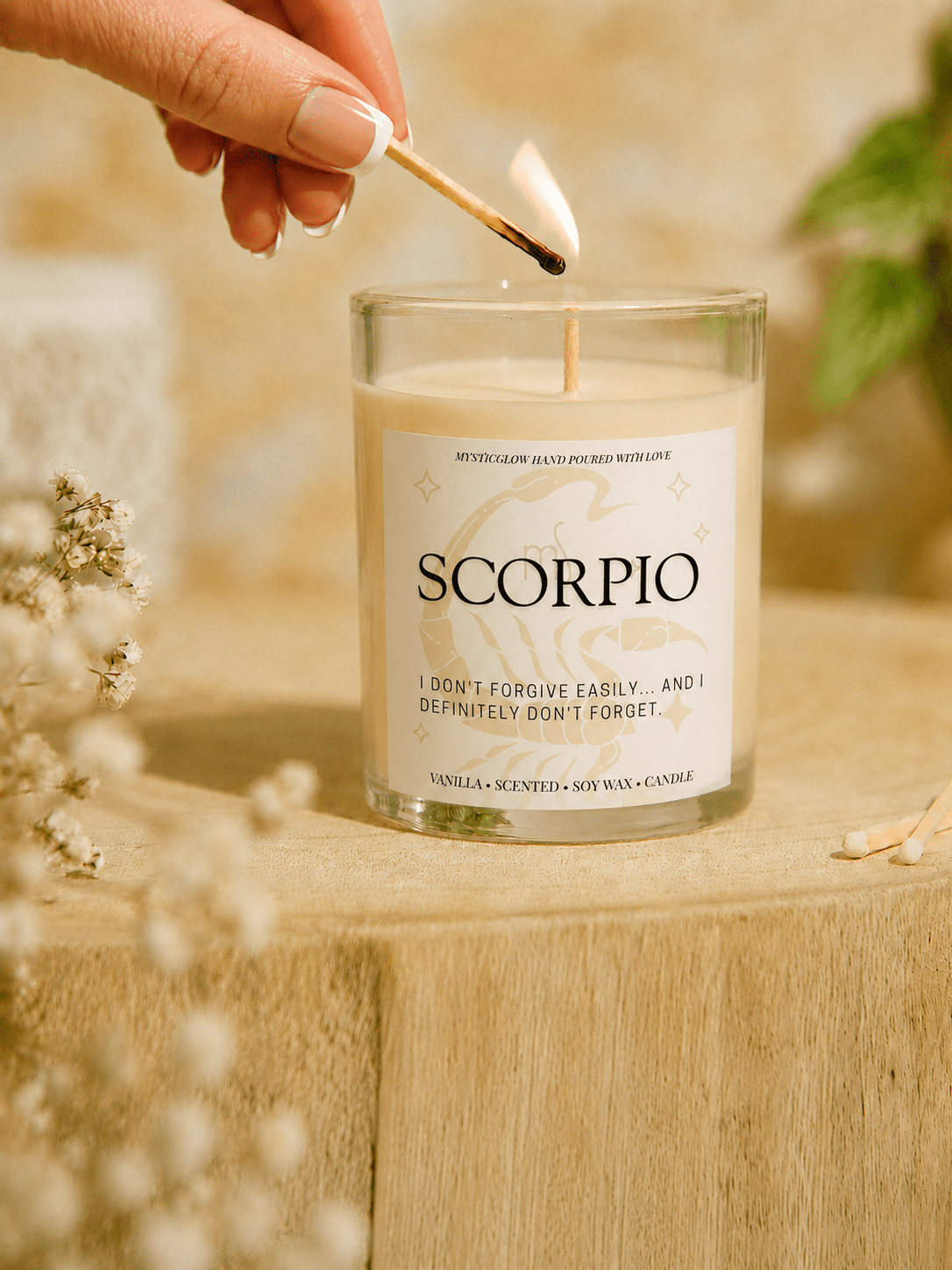 Scorpio zodiac candle being lit by hand by MysticGlow