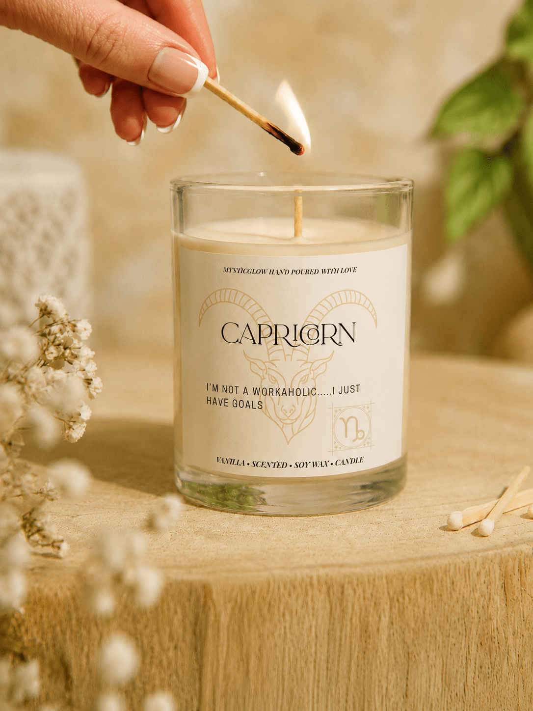 Capricorn zodiac candle being lit by hand by MysticGlow